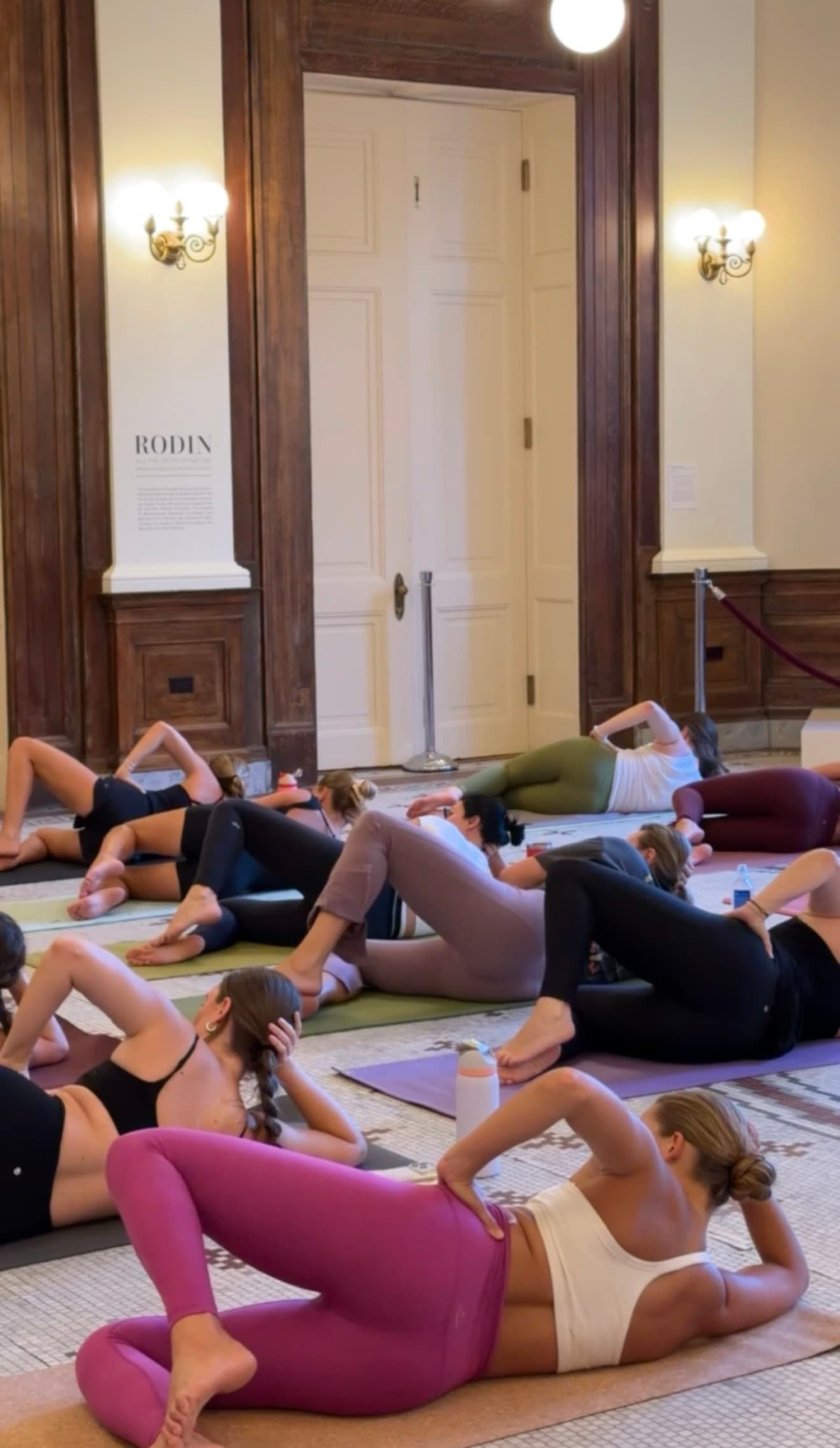 Guests mid-Pilates flow in the Gibbes rotunda